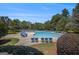 Large community pool surrounded by lounge chairs and lush landscaping, perfect for relaxation at 3005 Nicholas Dr, Villa Rica, GA 30180