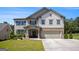 Charming two-story home featuring a spacious two-car garage, complemented by a well-manicured lawn and inviting entrance at 3005 Nicholas Dr, Villa Rica, GA 30180