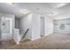 Upstairs hallway leading to rooms, featuring carpeting and a railing at 3005 Nicholas Dr, Villa Rica, GA 30180