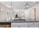 Spacious kitchen with granite countertops and stainless steel appliances overlooks living room at 3005 Nicholas Dr, Villa Rica, GA 30180
