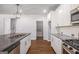 Open kitchen view of stainless steel appliances and granite countertops at 3005 Nicholas Dr, Villa Rica, GA 30180