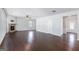 Hardwood floors complement a living room with a stone fireplace and an open layout to the entry and other rooms at 3005 Nicholas Dr, Villa Rica, GA 30180