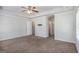 Main bedroom with neutral walls, carpet, and doorways to ensuite bathroom and walk-in closet at 3005 Nicholas Dr, Villa Rica, GA 30180