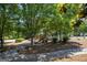 Community playground featuring a slide, climbing structure, and mature trees at 3005 Nicholas Dr, Villa Rica, GA 30180