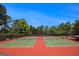 Well-maintained tennis courts in a lovely community setting, surrounded by mature trees at 3005 Nicholas Dr, Villa Rica, GA 30180