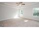 Bright and spacious bedroom with plush carpeting and ample natural light at 267 Eason St, Bowdon, GA 30108