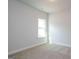 Bright bedroom with a large window and neutral carpet at 267 Eason St, Bowdon, GA 30108