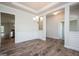 Spacious dining area with hardwood floors, decorative wainscoting, and elegant lighting at 267 Eason St, Bowdon, GA 30108