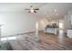 Bright living room with hardwood floors, a fireplace, and an open layout to the kitchen at 267 Eason St, Bowdon, GA 30108