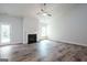 Spacious living room with hardwood floors, a fireplace, and natural light at 267 Eason St, Bowdon, GA 30108