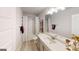 Bathroom featuring modern fixtures, decorative shower curtain and lots of counter space at 263 Eason St, Bowdon, GA 30108