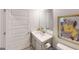 Bright bathroom with a vanity, mirror, and toilet at 263 Eason St, Bowdon, GA 30108