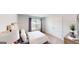 Cozy bedroom with a comfortable bed, a window for natural light, and a double door closet at 263 Eason St, Bowdon, GA 30108