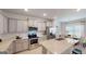 Stylish kitchen with stainless steel appliances, granite countertops, and a breakfast bar at 263 Eason St, Bowdon, GA 30108