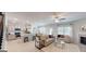Open-concept living room featuring a fireplace, modern furnishings, and ample natural light at 263 Eason St, Bowdon, GA 30108