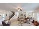 Spacious living room with stairs and an open layout that connects to the kitchen and dining area at 263 Eason St, Bowdon, GA 30108