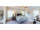 Comfortable bedroom featuring a plush bed, soft carpet, and decorative bedside lamps at 263 Eason St, Bowdon, GA 30108