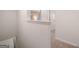 Bright hallway with neutral carpet and white walls, leading to other rooms at 1402 Grand Branch Dr, Lawrenceville, GA 30045