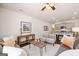 Inviting living room and kitchen with stainless steel appliances, a breakfast bar, and a modern aesthetic at 1402 Grand Branch Dr, Lawrenceville, GA 30045