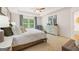 Spacious main bedroom featuring neutral decor, tray ceiling, and lots of natural light at 1402 Grand Branch Dr, Lawrenceville, GA 30045