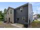 Exterior view of home showing patio area with green space and side of home at 2137 Chadwick Sw Rd, Atlanta, GA 30331