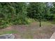 Backyard view showing tree line, and lamp post at 2137 Chadwick Sw Rd, Atlanta, GA 30331