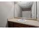 Bathroom with traditional vanity, sink, and mirror over the counter at 2137 Chadwick Sw Rd, Atlanta, GA 30331