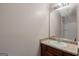 Bathroom with vanity and granite countertop, with a large mirror above at 2137 Chadwick Sw Rd, Atlanta, GA 30331