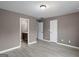 Bedroom view showing an entry to a bathroom, neutral paint, hardwood floors, trim at 2137 Chadwick Sw Rd, Atlanta, GA 30331