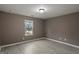 This bedroom has hardwood floors, neutral paint, and natural light from a window at 2137 Chadwick Sw Rd, Atlanta, GA 30331