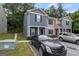 Townhouse exterior featuring dark gray facade and front parking at 2137 Chadwick Sw Rd, Atlanta, GA 30331