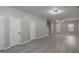 Bright and spacious living room with modern gray flooring and fresh paint at 2137 Chadwick Sw Rd, Atlanta, GA 30331