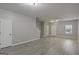 Spacious living room with gray floors and various entryways at 2137 Chadwick Sw Rd, Atlanta, GA 30331