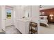 Well-lit bathroom with double sinks, a large mirror, and a glimpse into the primary bedroom at 1404 Gray Branch Dr, Lawrenceville, GA 30045