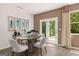 An eat-in dining area features a stylish table and chairs, with a walkout to the exterior at 1404 Gray Branch Dr, Lawrenceville, GA 30045