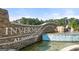 Welcome to Inverness at Sugarloaf sign with beautiful water feature entrance at 1404 Gray Branch Dr, Lawrenceville, GA 30045