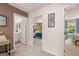 Upstairs hallway showing access to a bathroom on the left and two bedrooms at 1404 Gray Branch Dr, Lawrenceville, GA 30045