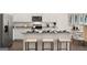Stylish kitchen island with granite countertops and seating, blending function and design at 1404 Gray Branch Dr, Lawrenceville, GA 30045
