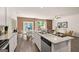 Open-concept kitchen and dining area featuring modern finishes and seamless flow to the living space at 1404 Gray Branch Dr, Lawrenceville, GA 30045