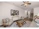 An open concept floorplan features modern furnishings in the living room and a staircase at 1404 Gray Branch Dr, Lawrenceville, GA 30045