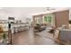 Open-concept living space with kitchen island, dining area, and inviting living room with large window at 1404 Gray Branch Dr, Lawrenceville, GA 30045