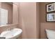 A well-lit powder room features a modern sink and a toilet at 1404 Gray Branch Dr, Lawrenceville, GA 30045