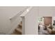 A staircase leads to an upper floor living room featuring stylish modern furnishings at 1404 Gray Branch Dr, Lawrenceville, GA 30045