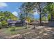 View of backyard with a nice patio area, the back of the house, and a storage shed at 113 Caldwell Dr, Hampton, GA 30228