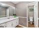 A bathroom with vanity, sink, and toilet in a well-maintained home at 113 Caldwell Dr, Hampton, GA 30228