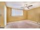 Bedroom with carpet flooring, ceiling fan, and window with curtains for natural light at 113 Caldwell Dr, Hampton, GA 30228