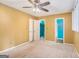 Bedroom featuring carpet flooring, ceiling fan, closet, and ensuite bathroom at 113 Caldwell Dr, Hampton, GA 30228