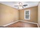 Bedroom with laminate flooring, a ceiling fan, and a window with blinds at 113 Caldwell Dr, Hampton, GA 30228