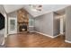 Spacious living room with a stone fireplace, high ceilings, and laminate floors at 113 Caldwell Dr, Hampton, GA 30228