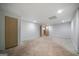 Unfinished basement with multiple access doors, providing flexibility for layout at 1460 Bakers Bridge Rd, Douglasville, GA 30134